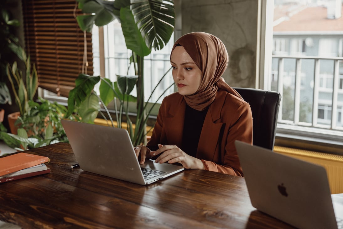 Woman with Laptop Working in the Office